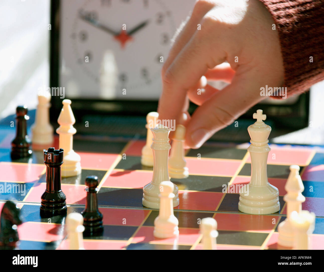 Closeup of boys hand playing speed chess Stock Photo
