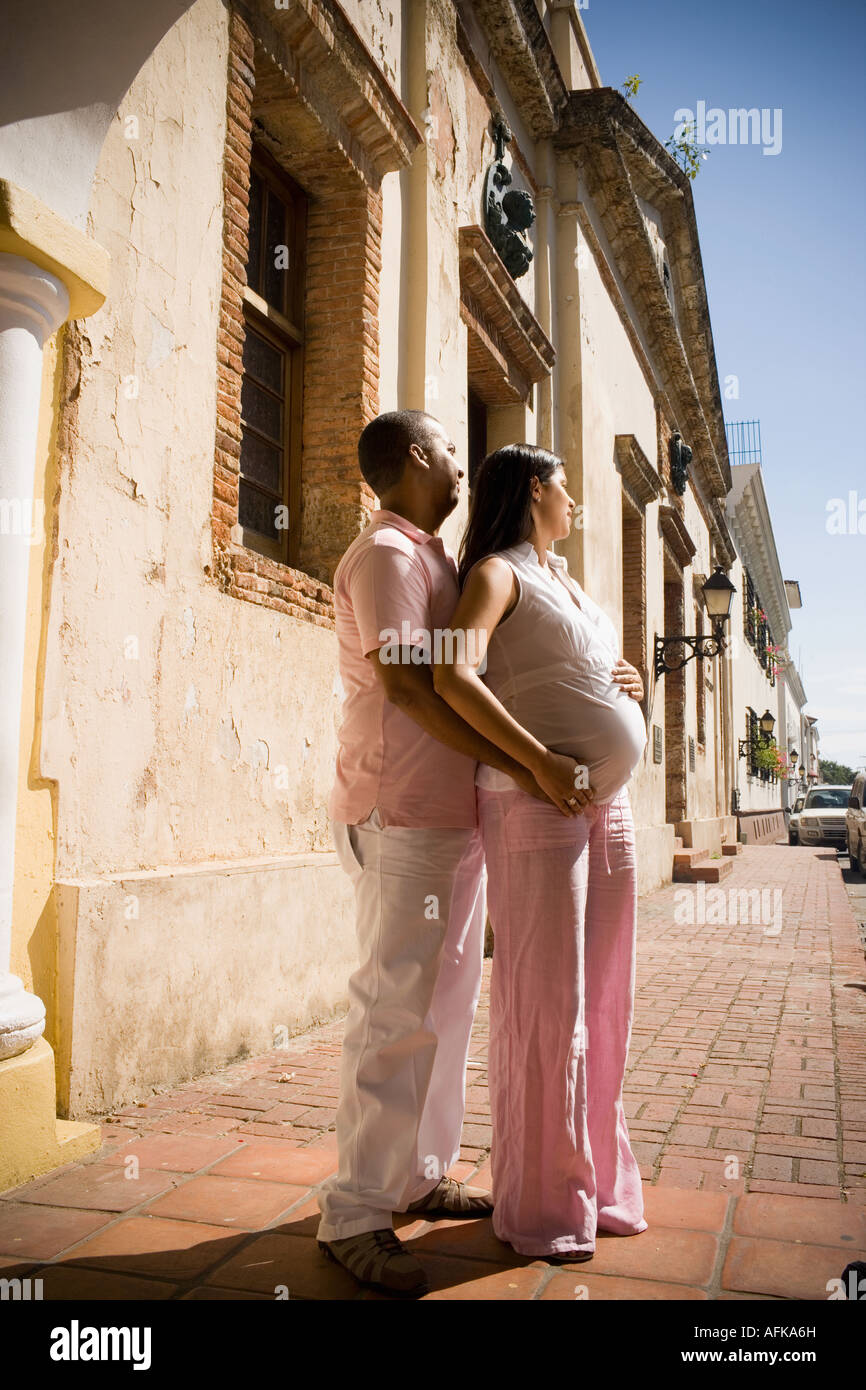 Man embracing and kissing a pregnant woman Stock Photo - Alamy
