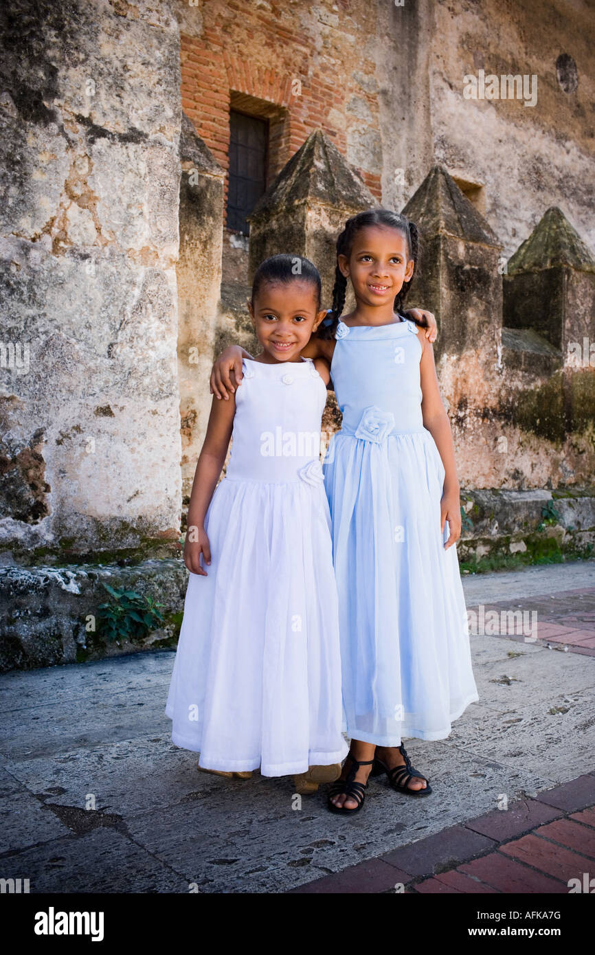 Two smiling girls with their arms around each other Stock Photo - Alamy