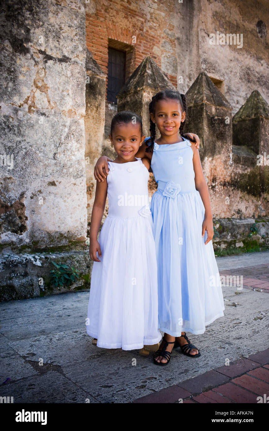Two girls with their arms around each other Stock Photo - Alamy