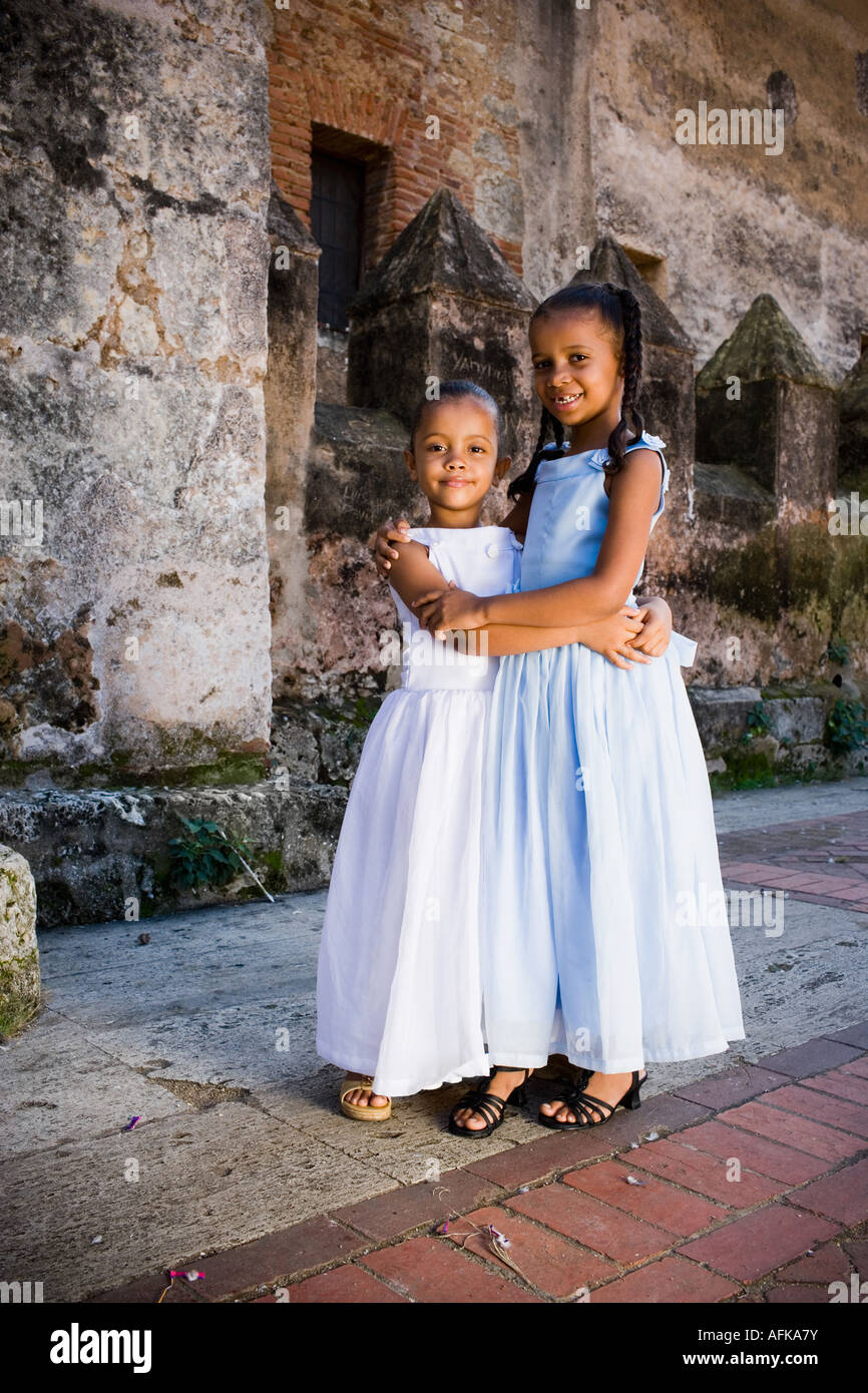 Portrait of two girls smiling and hugging each other Stock Photo - Alamy