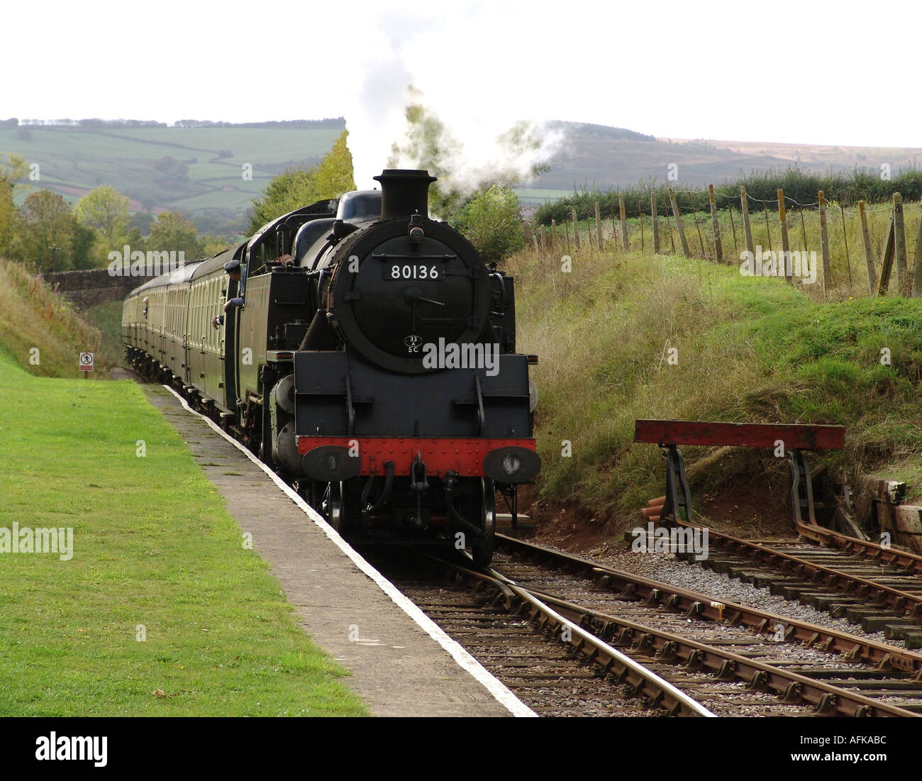 Steam train entering the Railway Station at Washford England GB UK 2004 Stock Photo
