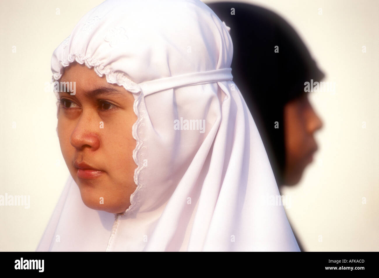 Two Muslim women with traditional head scarves in Java Indonesia Model Released Photo Stock Photo