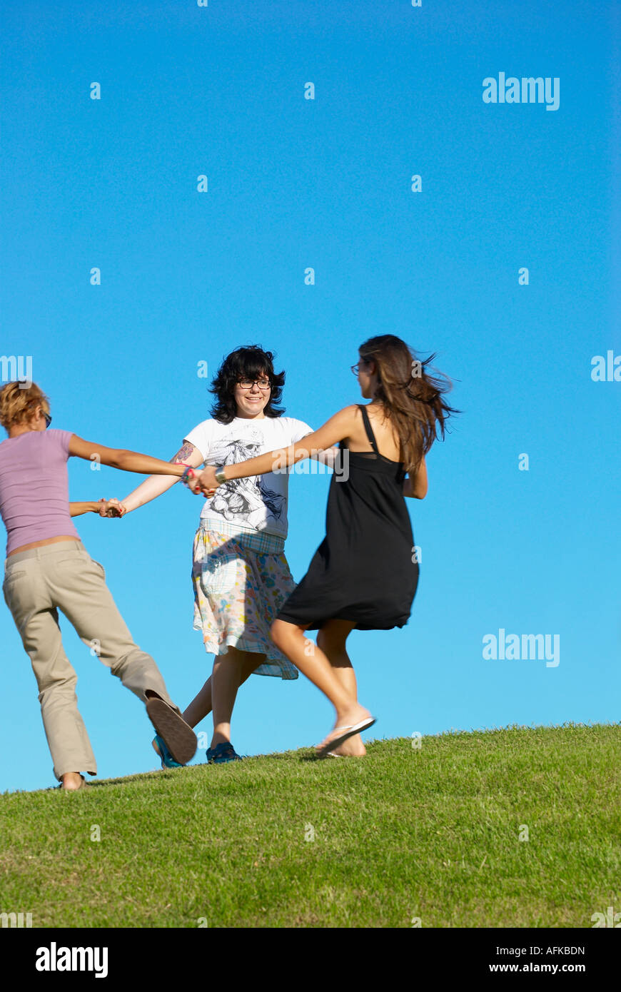 Friends turning in circles Stock Photo Alamy