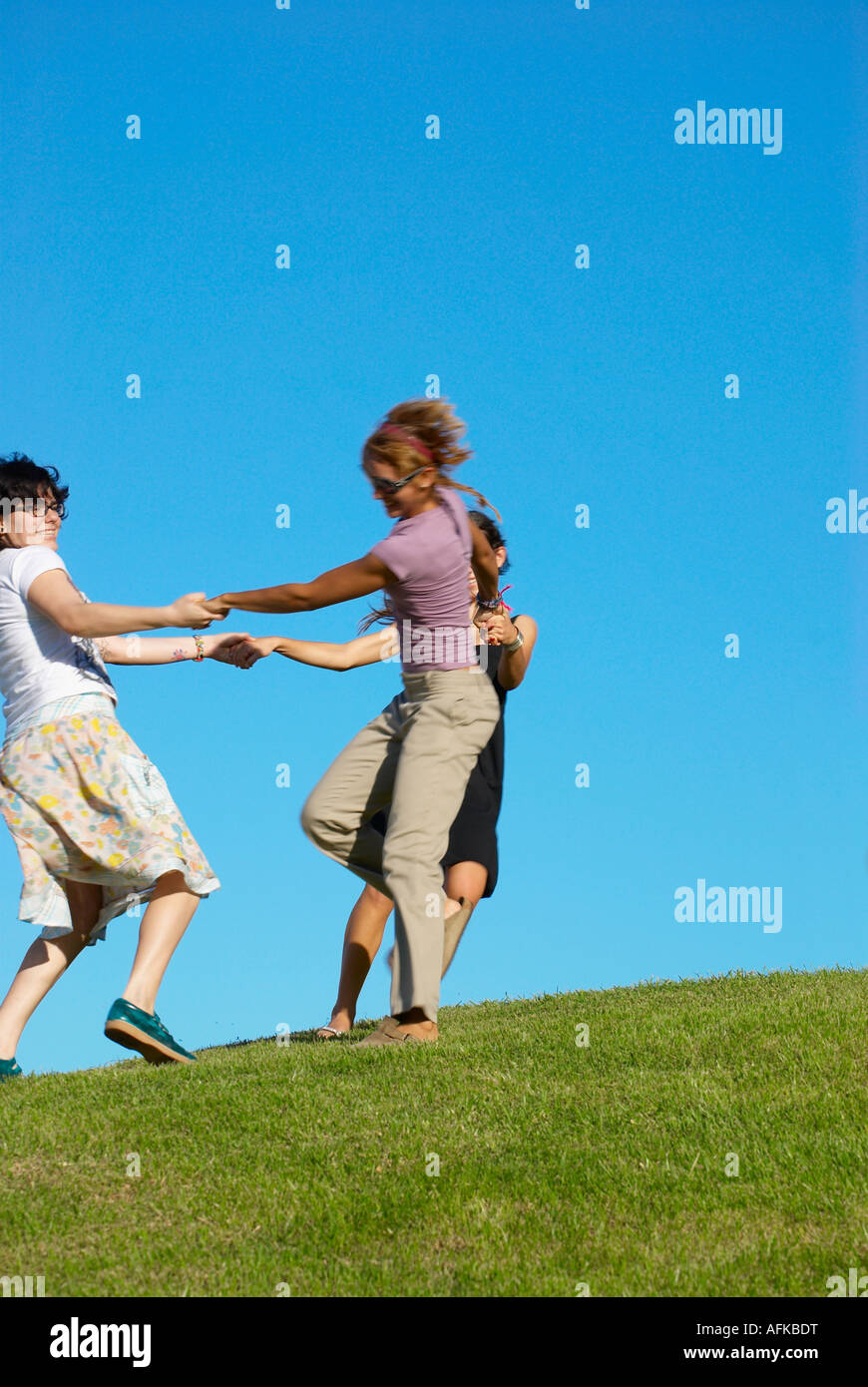 Friends turning in circles Stock Photo Alamy