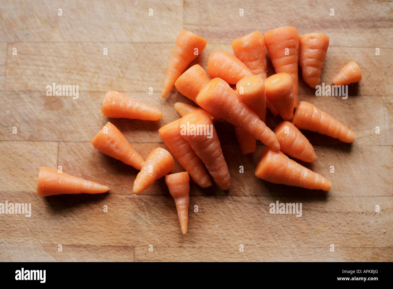 Homegrown organic carrots on a chopping board Stock Photo
