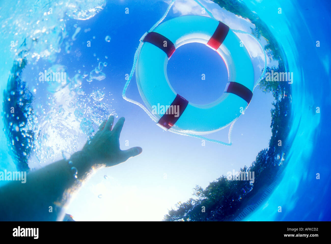 Hand reaching from underwater for floating lifesaver ring Model and