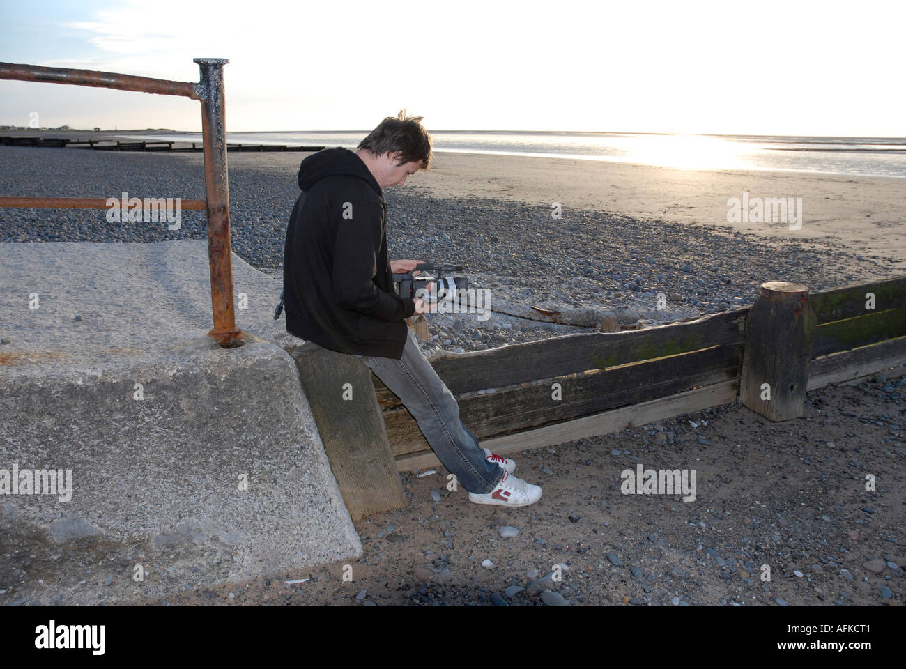 Teenager using video camera Stock Photo