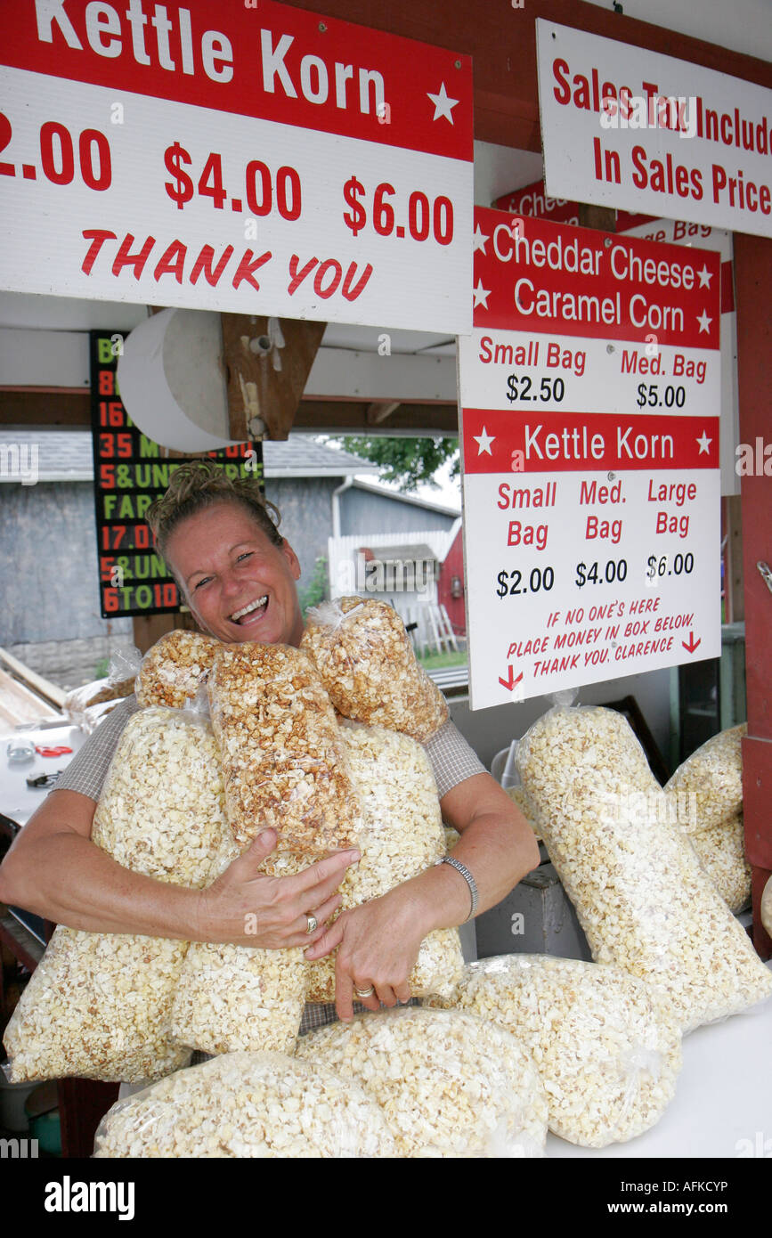 Woman female holds kettle popcorn bags hires stock photography and