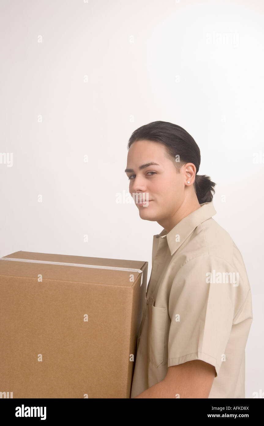 Delivery man carrying large box Stock Photo Alamy