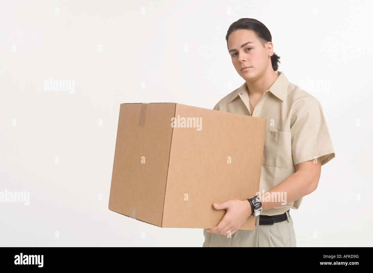 Delivery man carrying large box Stock Photo Alamy