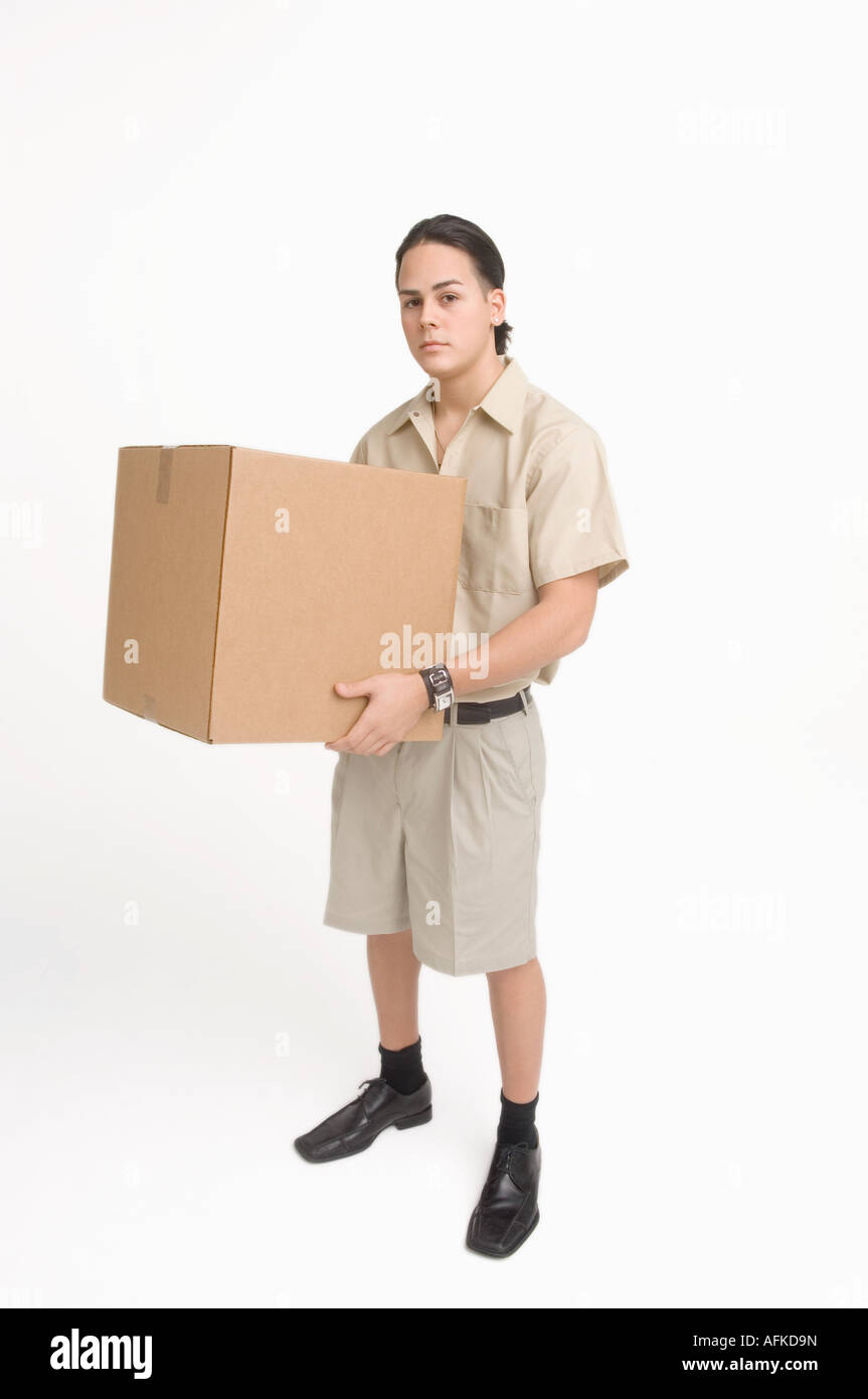 Delivery man carrying large box Stock Photo Alamy
