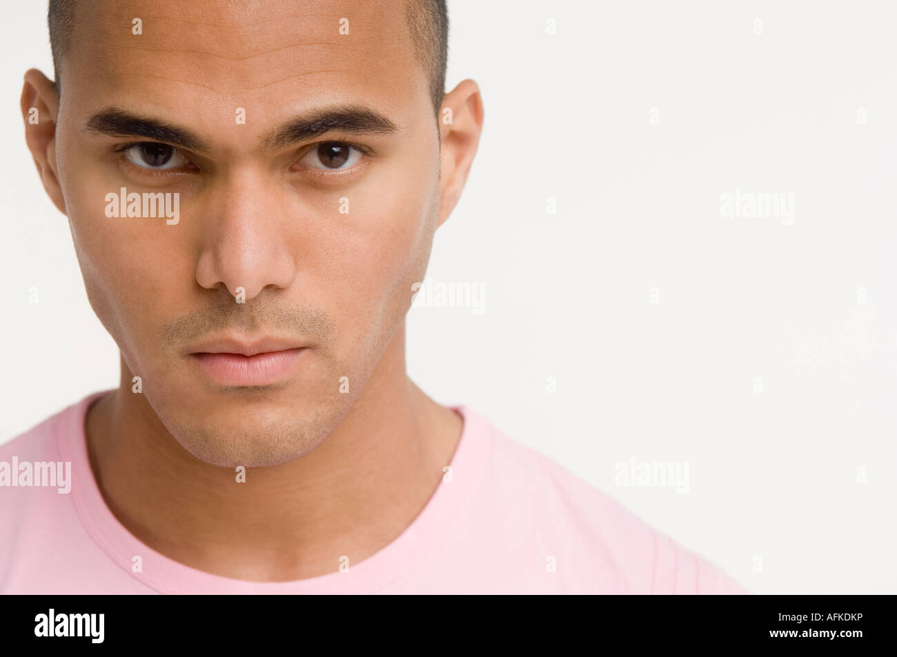 Portrait of young man looking at camera Stock Photo - Alamy