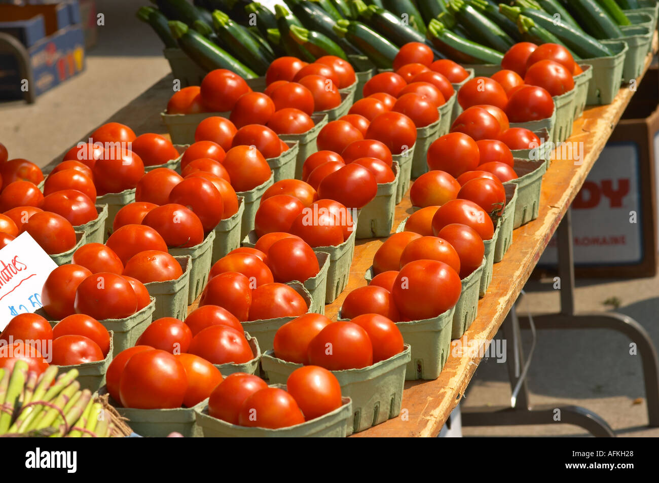 Tomatoes in baskets at the farmer s market Stock Photo - Alamy