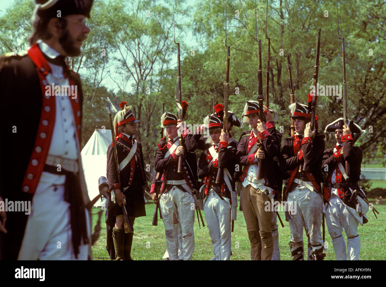 British soldiers american revolutionary war reenactors march in
