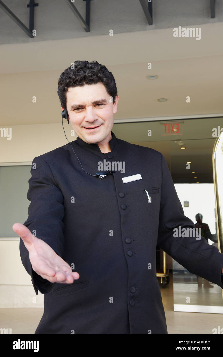 Portrait of a doorman gesturing Stock Photo Alamy