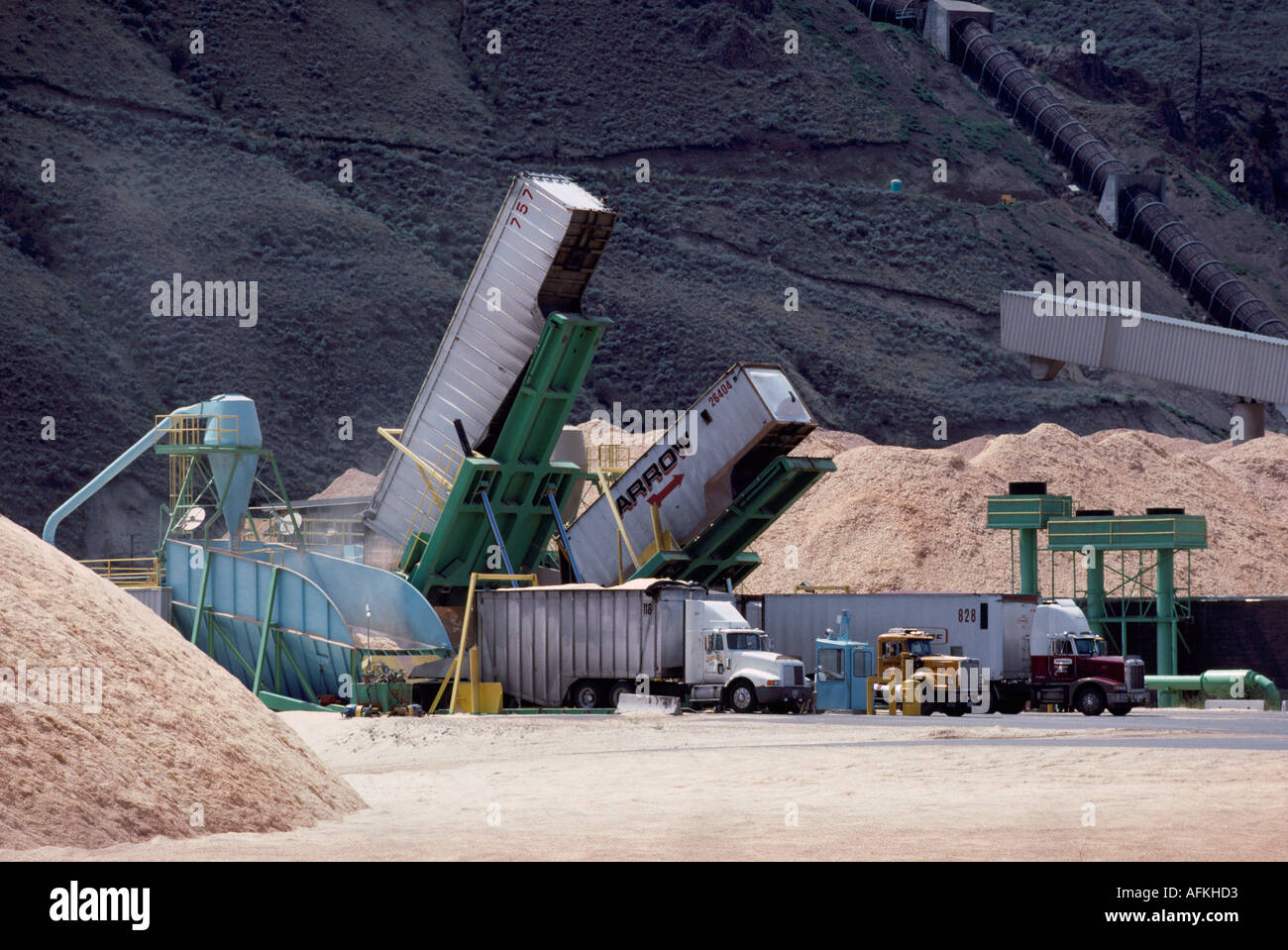 Wood Chips Waste, SemiTrailer Trucks unloading at Pulp Mill Chip Storage Piles, Kamloops, BC