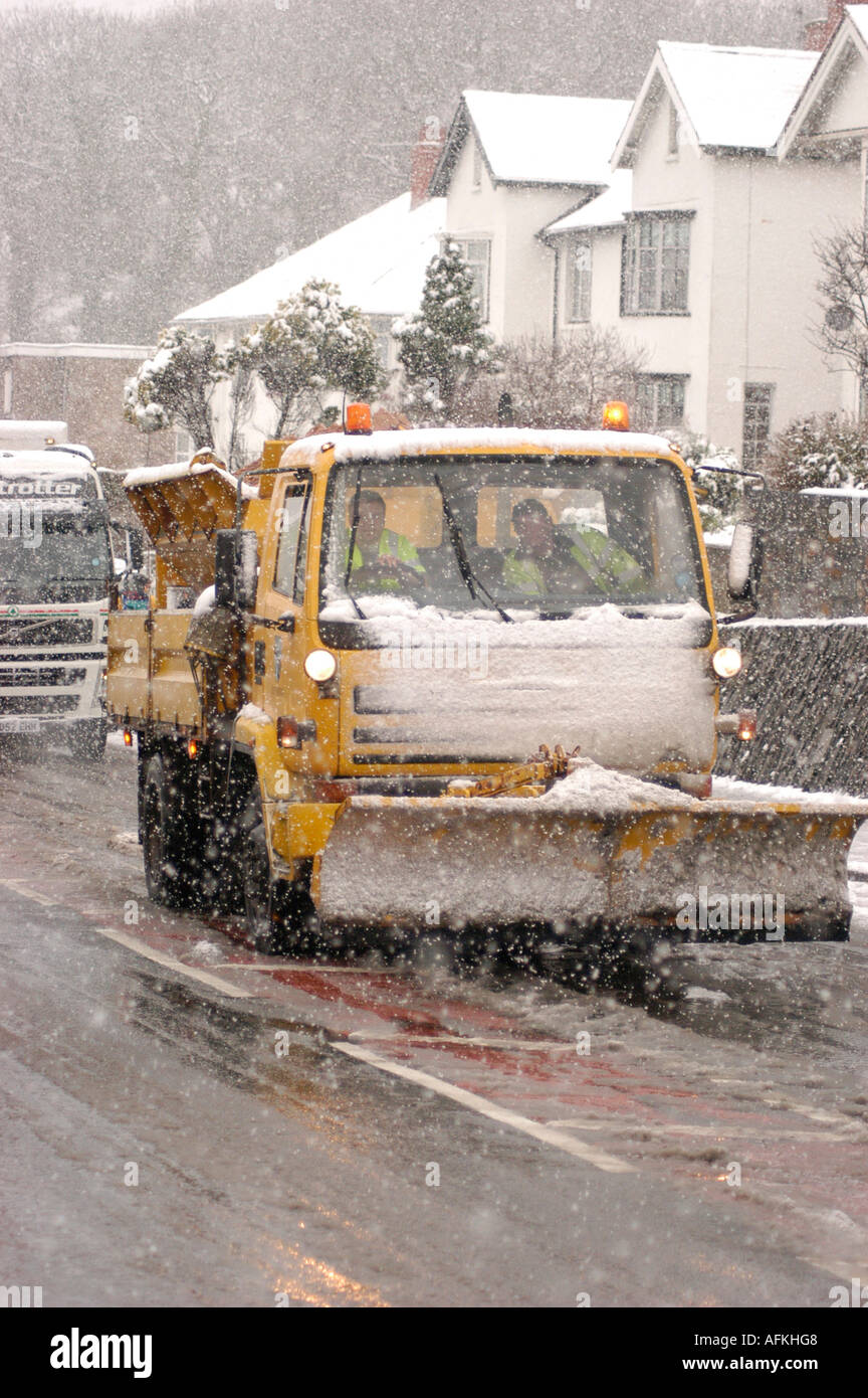 gritting and snow plough lorry Aberystwyth Ceredigion Wales driving in sleet snow and rain Stock Photo