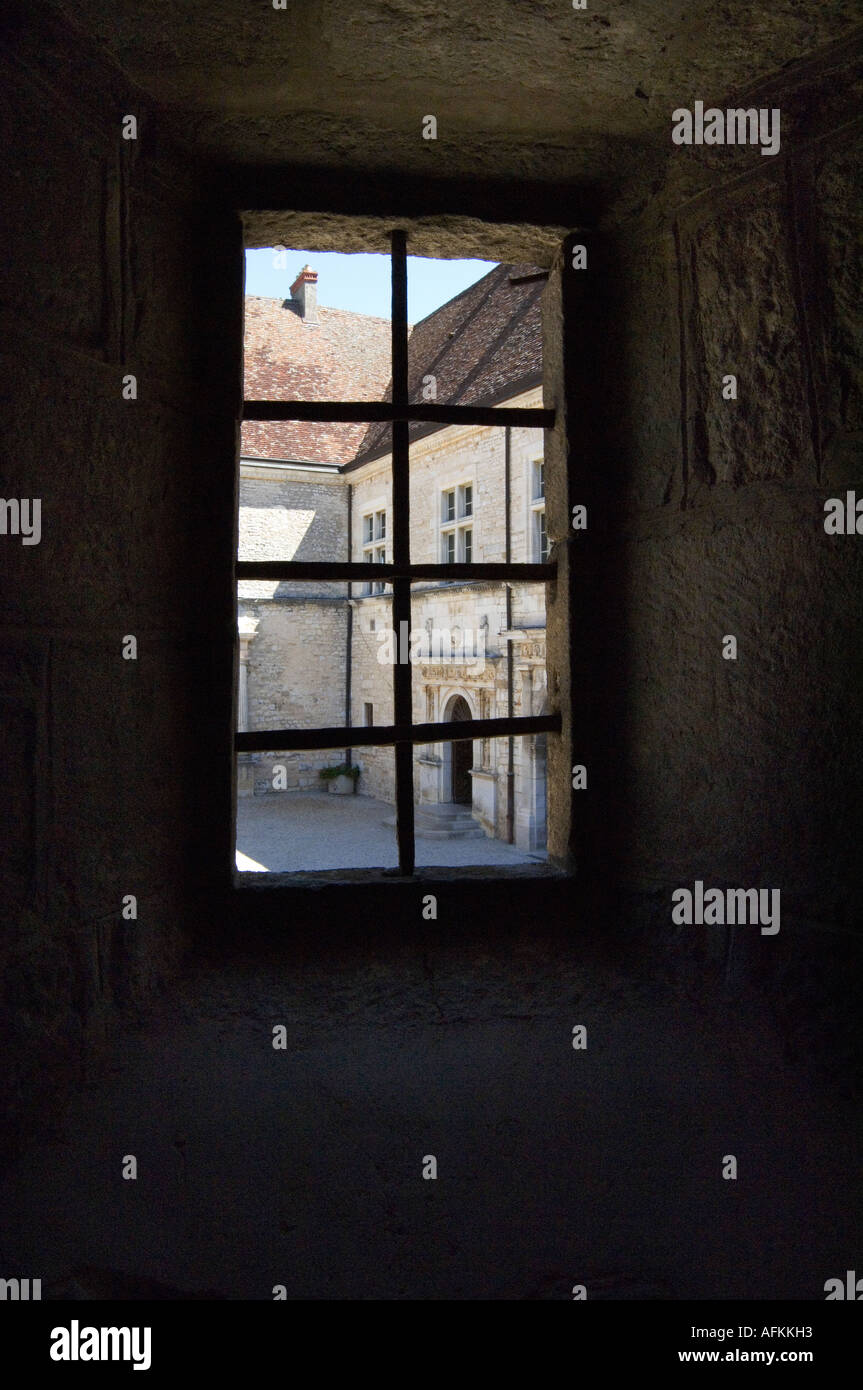 Looking out of a medieval window at Chateau Clos de Vougeot, Burgundy ...