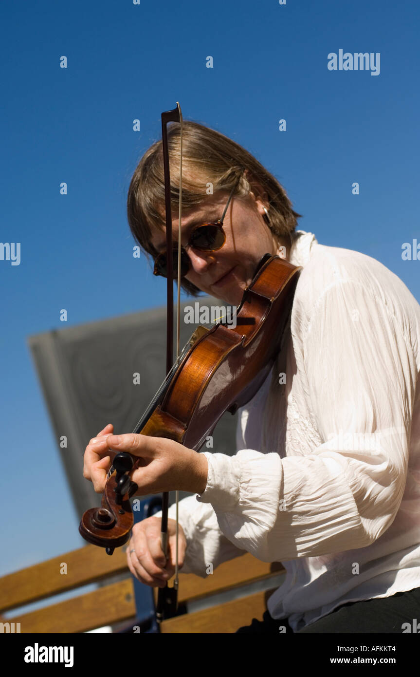 woman playing welsh folk music on fiddle violin Stock Photo