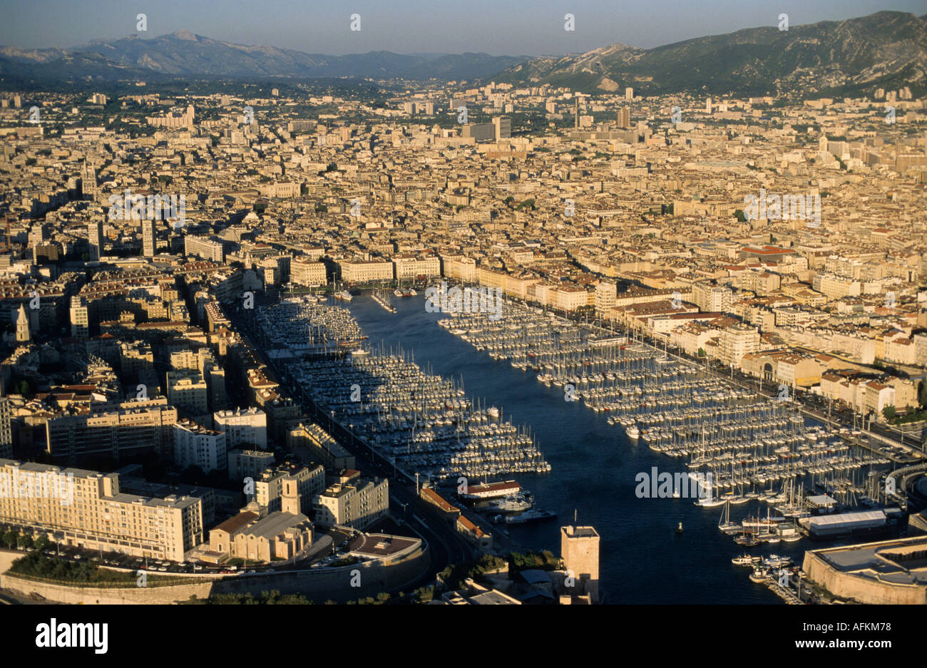 The Old Port (Vieux Port) and the city of Marseille, France - at dusk. Stock Photo