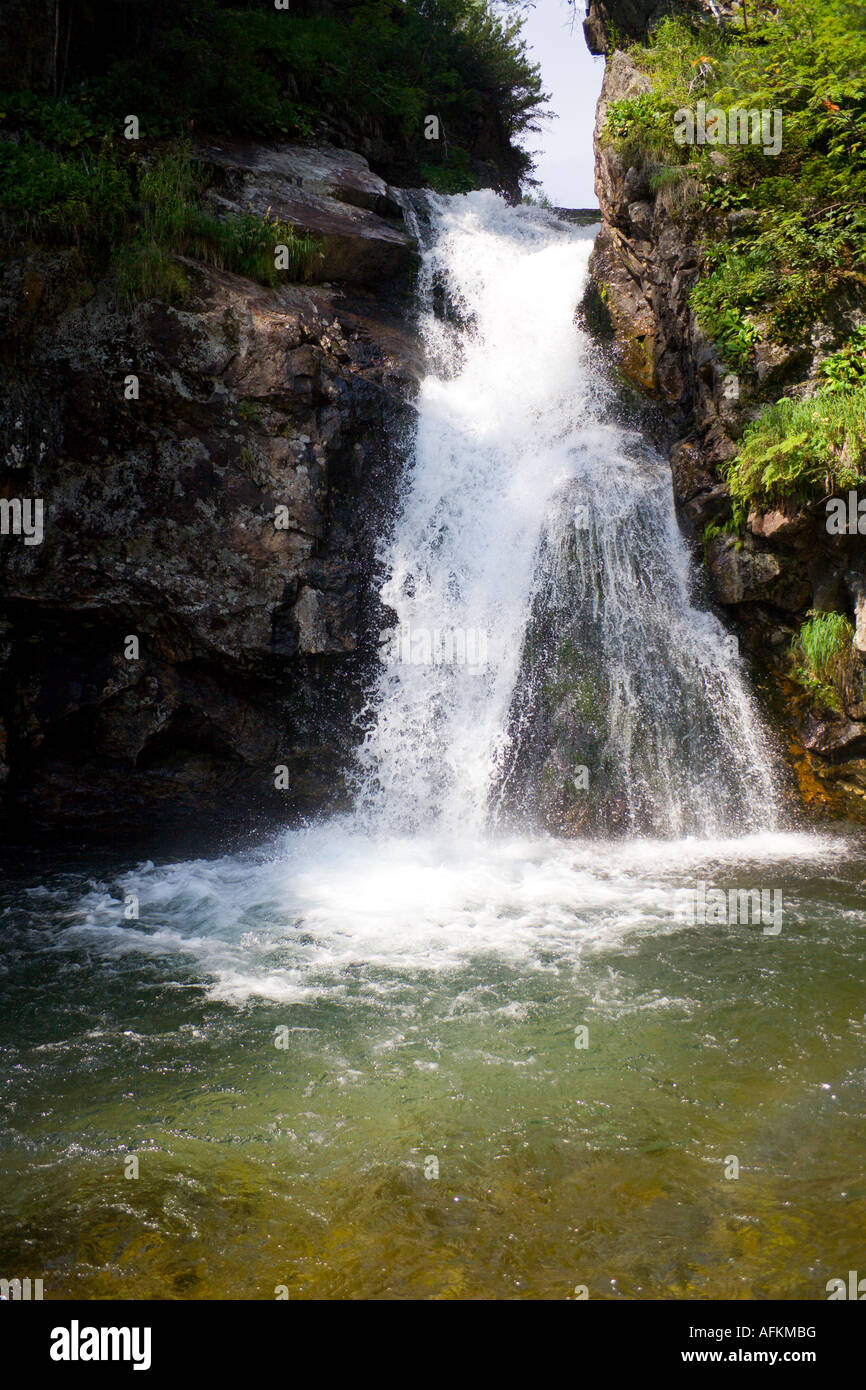 waterfall grohotun thunderer on the same name brook foothills of Sayan s mountain range Stock Photo
