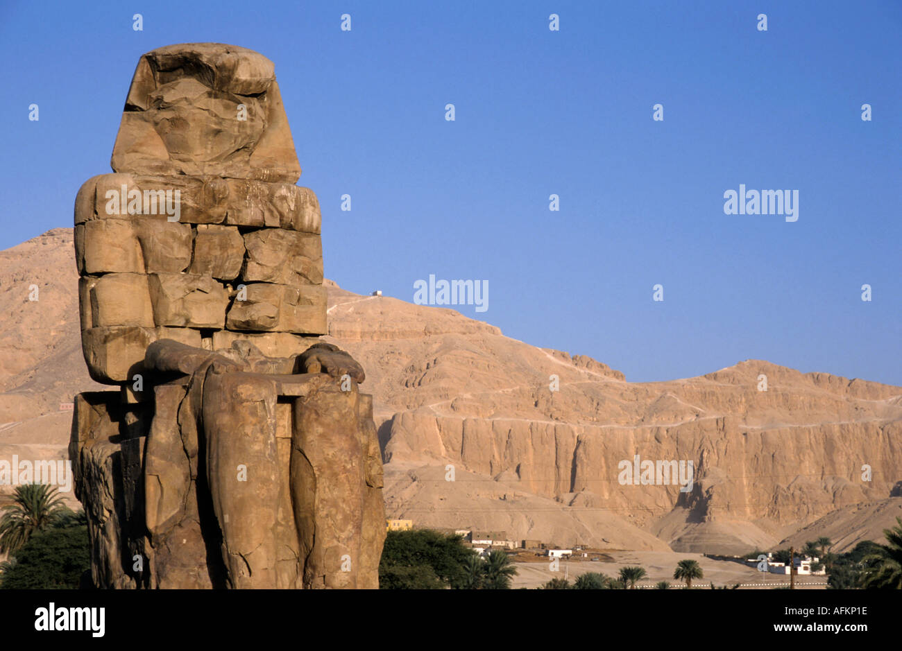 One of the two Colossi of Memnon giant statues of Pharaoh Amenhotep III