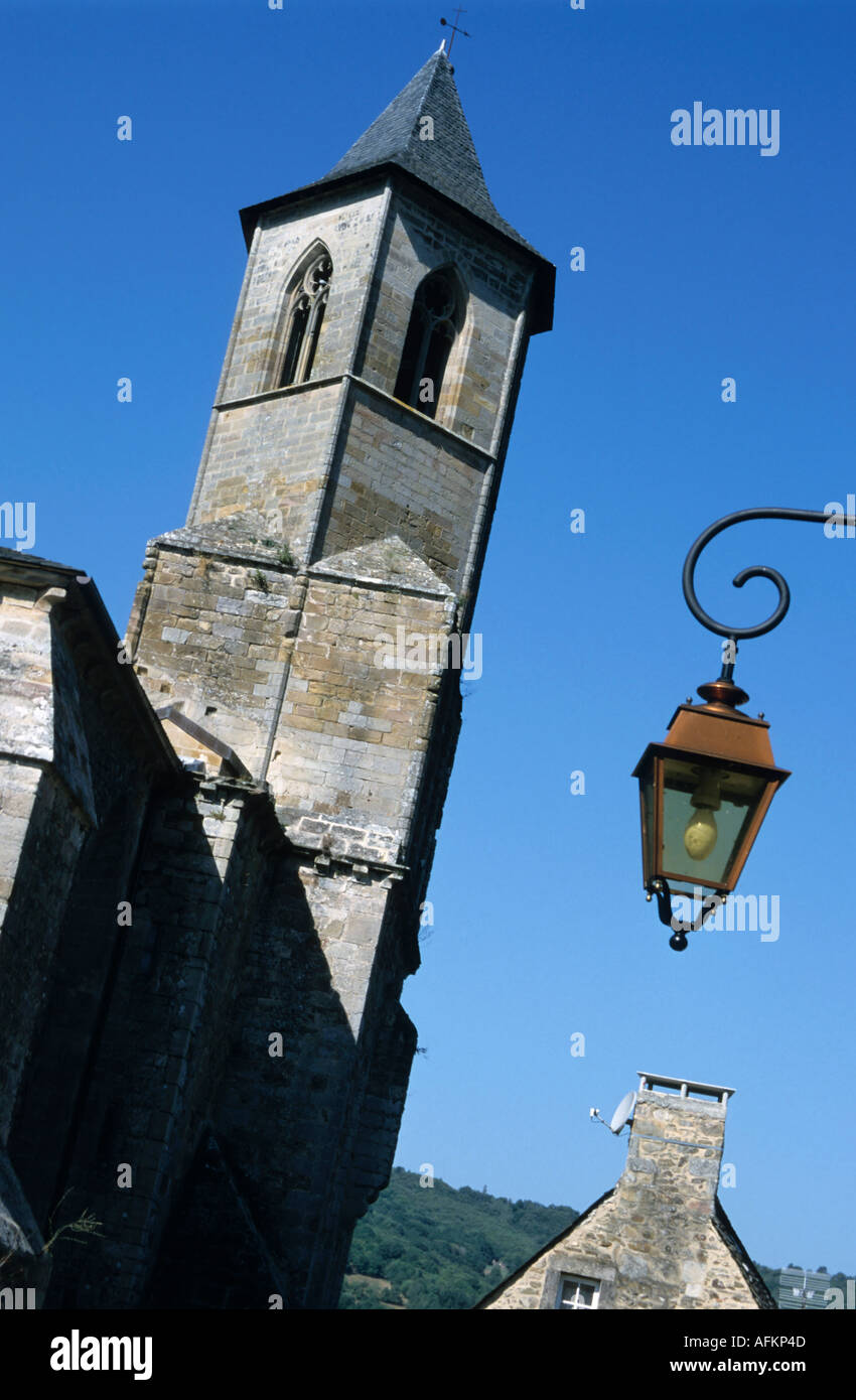 Medieval church bell tower and old-fashioned street lamp, Najac, Lot,  France Stock Photo - Alamy