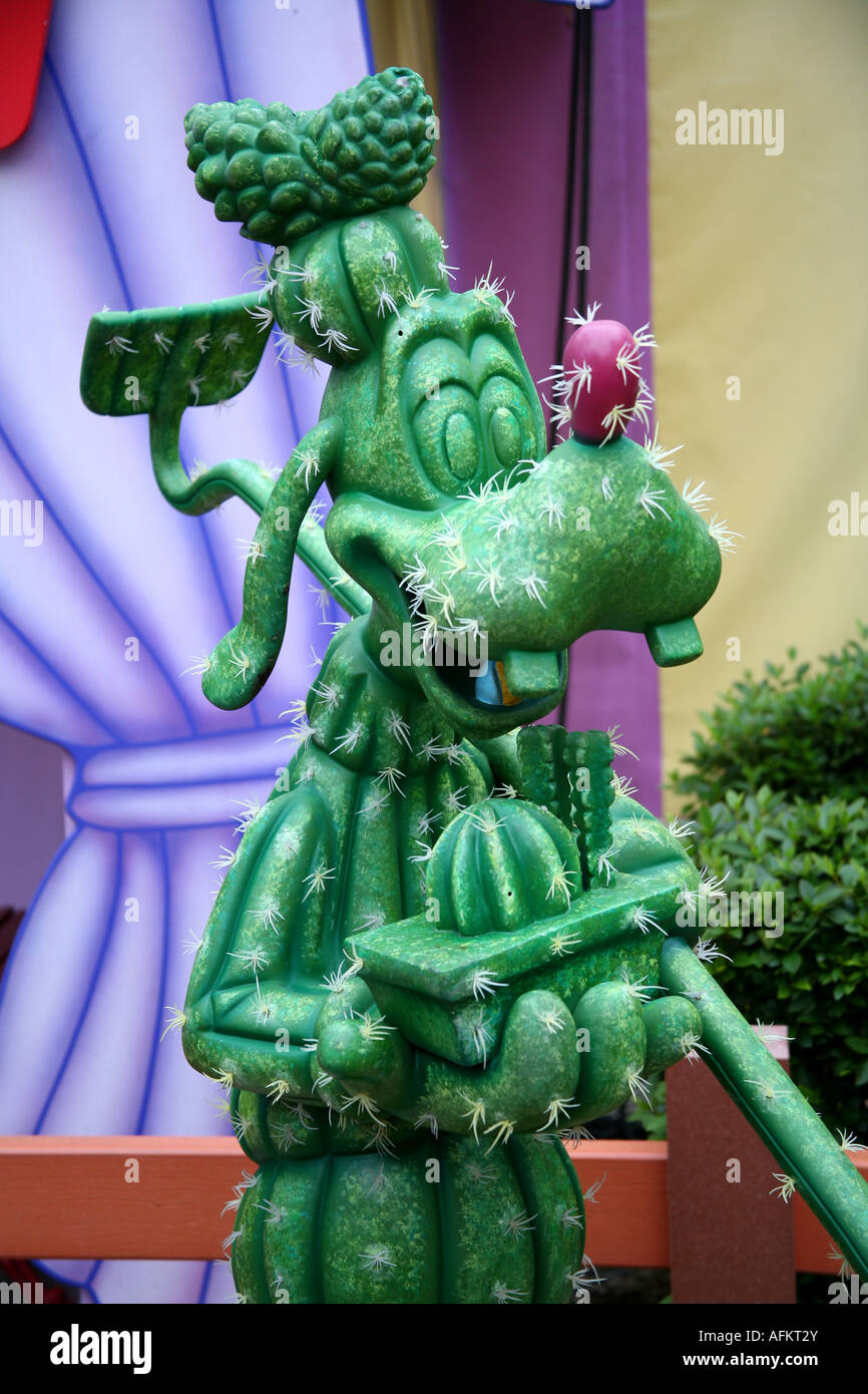 Disney characters on a Magic Kingdom Goofy statue made of an artificial cactus Stock Photo