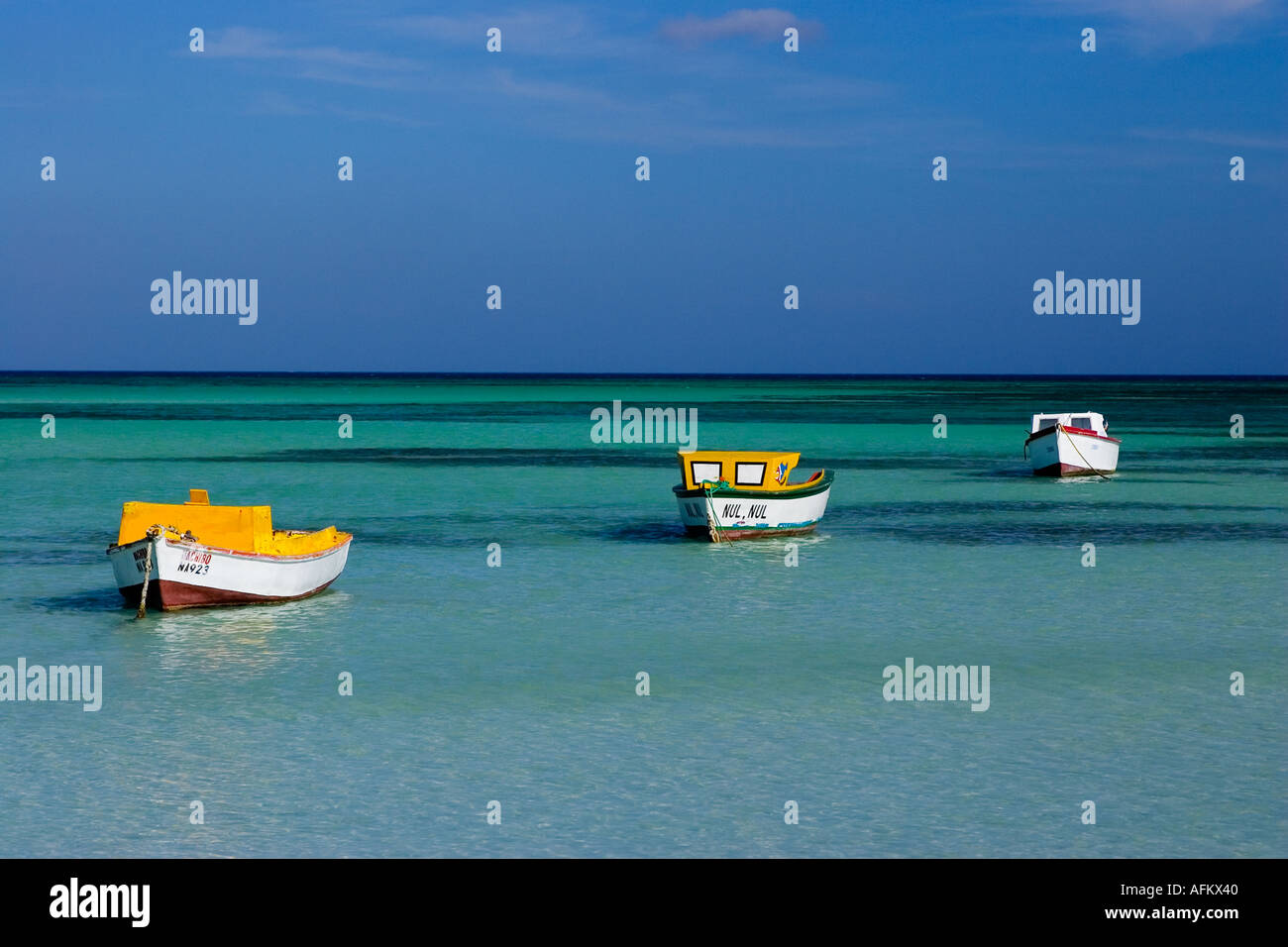 Three fishing boats in Aruba, Hadicurari beach Netherlands Antilles Stock Photo