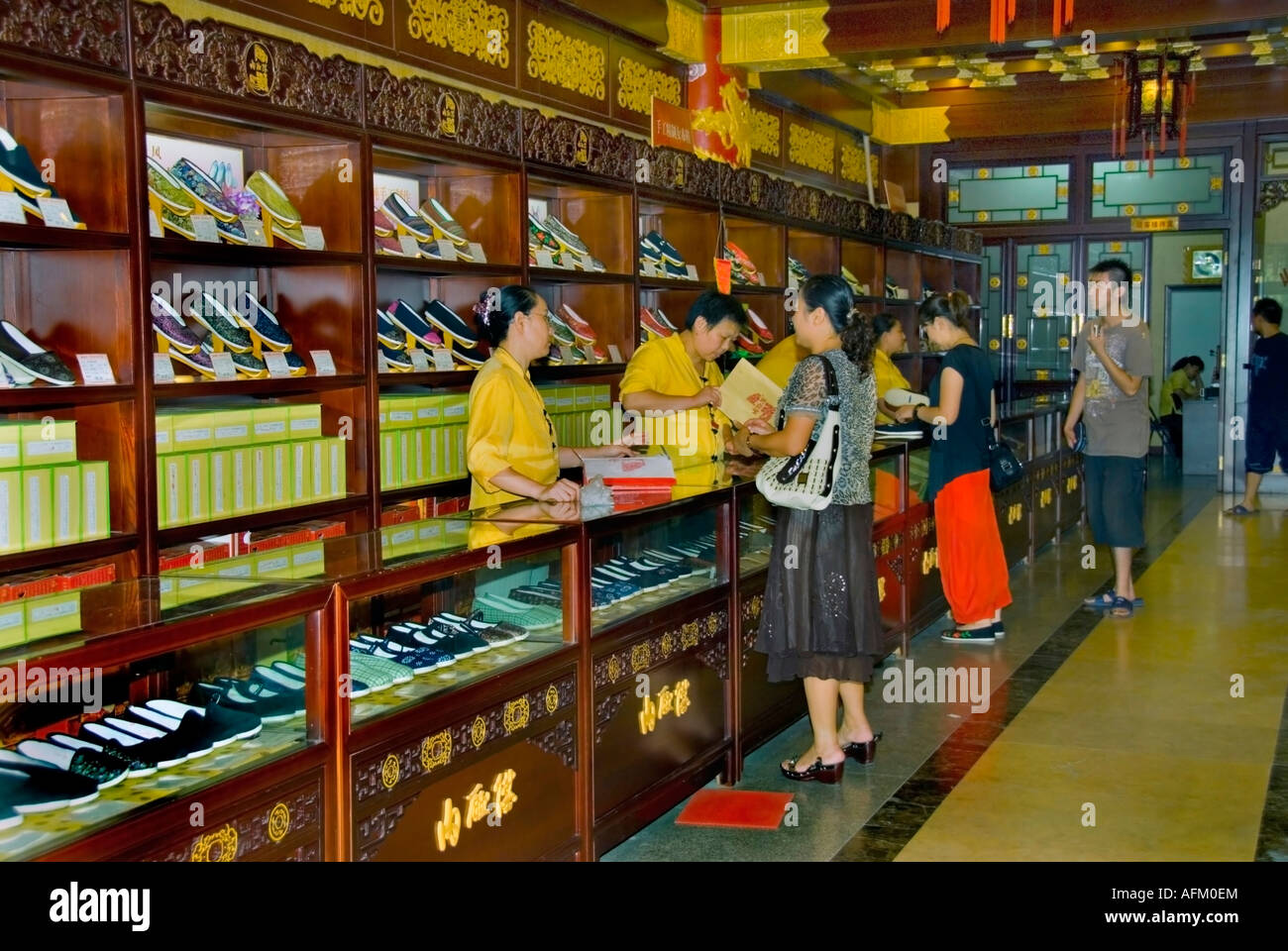 Beijing CHINA, Shopping Shoes Inside Traditional CHinese Shoe Store Woman  Buying Shoes at COunter "Neiliansheng SHoe Store" Dashilan Stock Photo -  Alamy