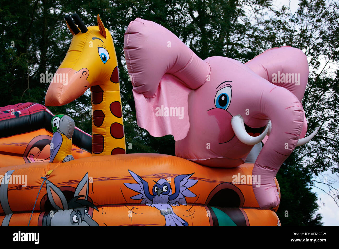 Noah's Ark bouncy castle with inflatable giraffe and elephant Stock Photo