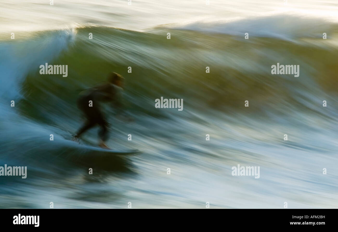 Surfer in slow motion Stock Photo
