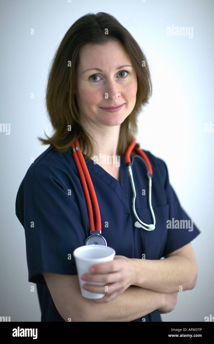 Portrait of Female Medical Doctor in Blue Scrubs with Stethoscope