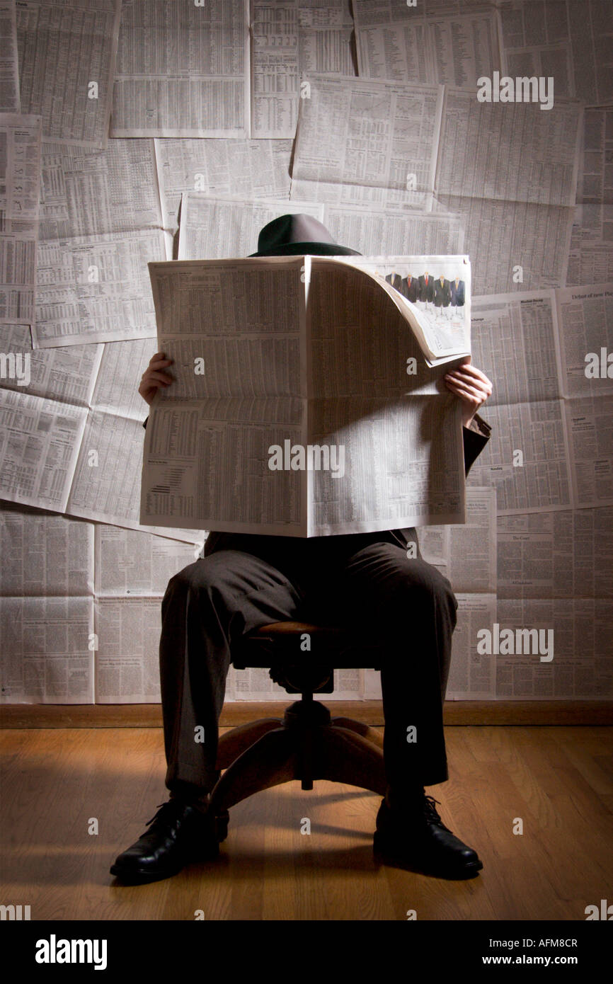 Man reading newspaper Stock Photo