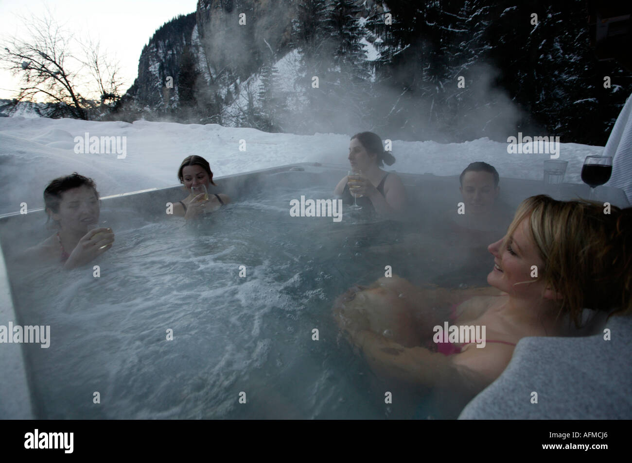 Girl snowboarders in a sauna steam bath after a heavy day on the slopes,  Morzine, Porte de Soleil, Alps, France, Europe Stock Photo - Alamy