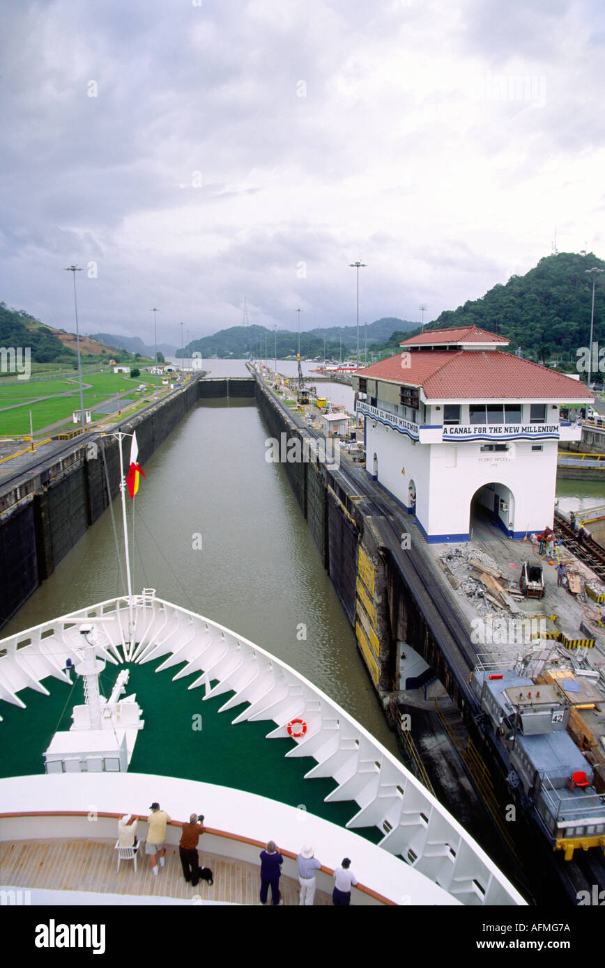 A cruise ship navigating a set of locks heading through the Panama ...