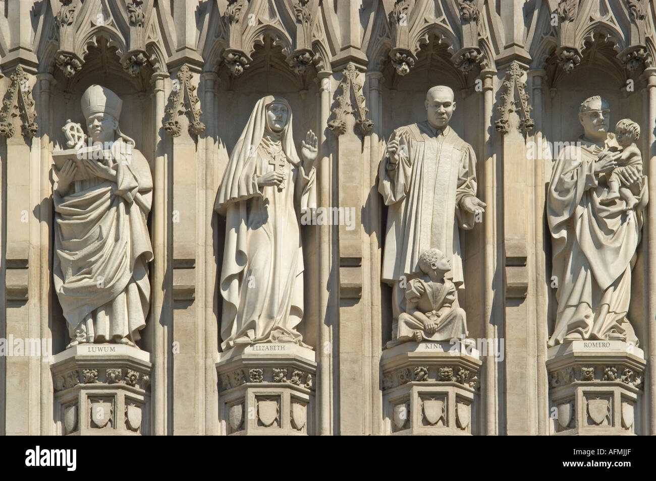 London, England, UK. Westminster Abbey Modern Martyr Statues over West Entrance: Janani Luwum, Grand Duchess Elizabeth, Oscar Romero, Martin Luther K. Stock Photo