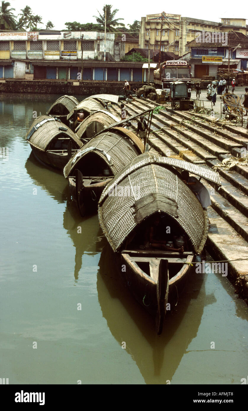 India Kerala Cochin traditional kettuvalam backwater boats at quayside Stock Photo