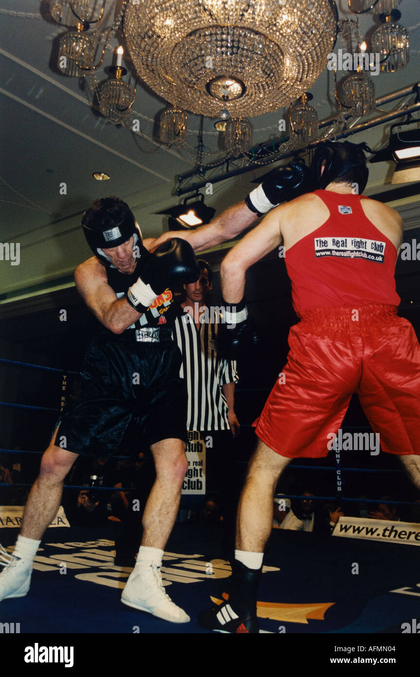 Punches thrown at The Real Fightclub Participants of the high adrenaline contact sport of white collar boxing Stock Photo