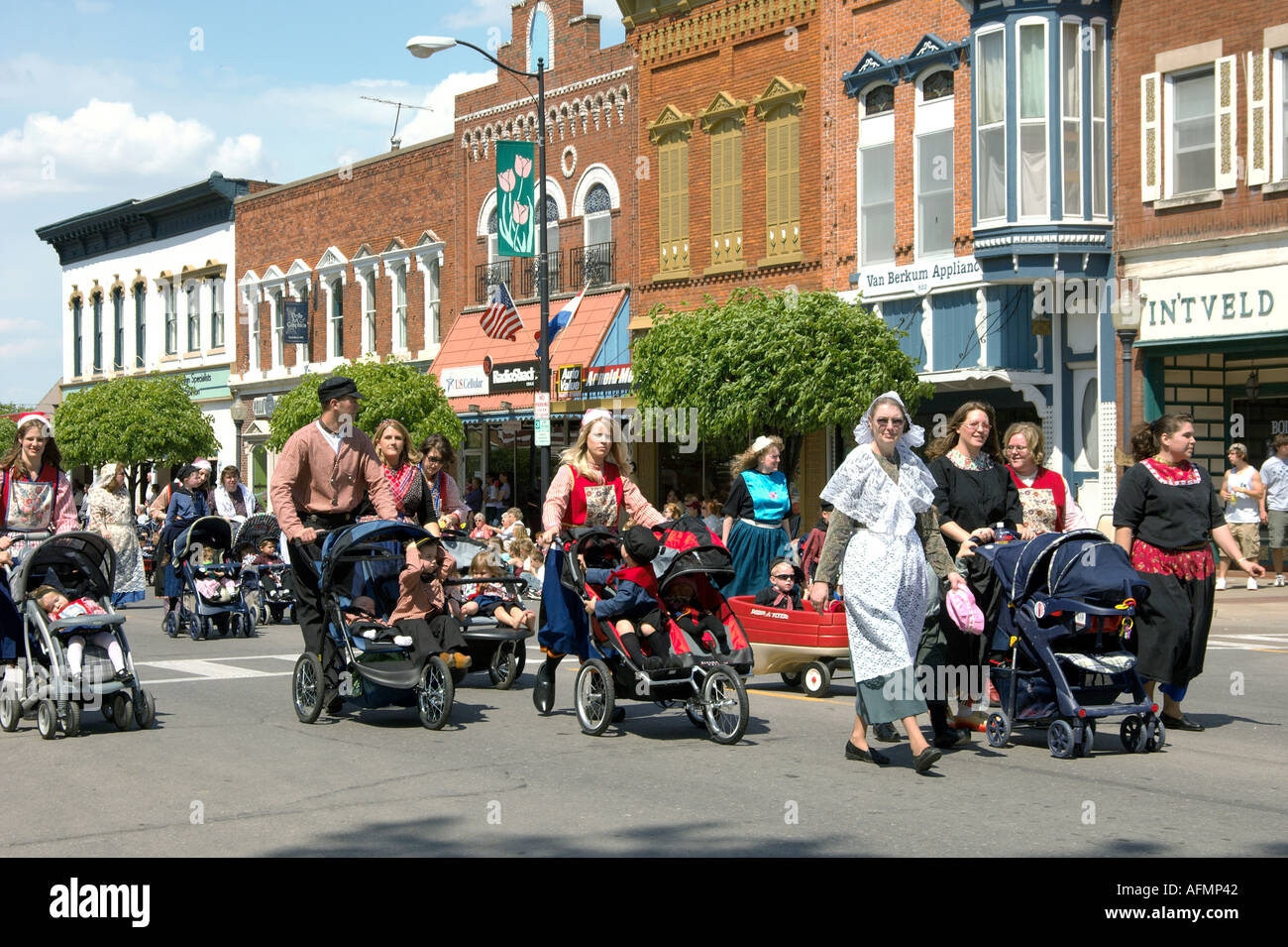 Dutch families marching in the Tulip Time parade in Pella Iowa USA