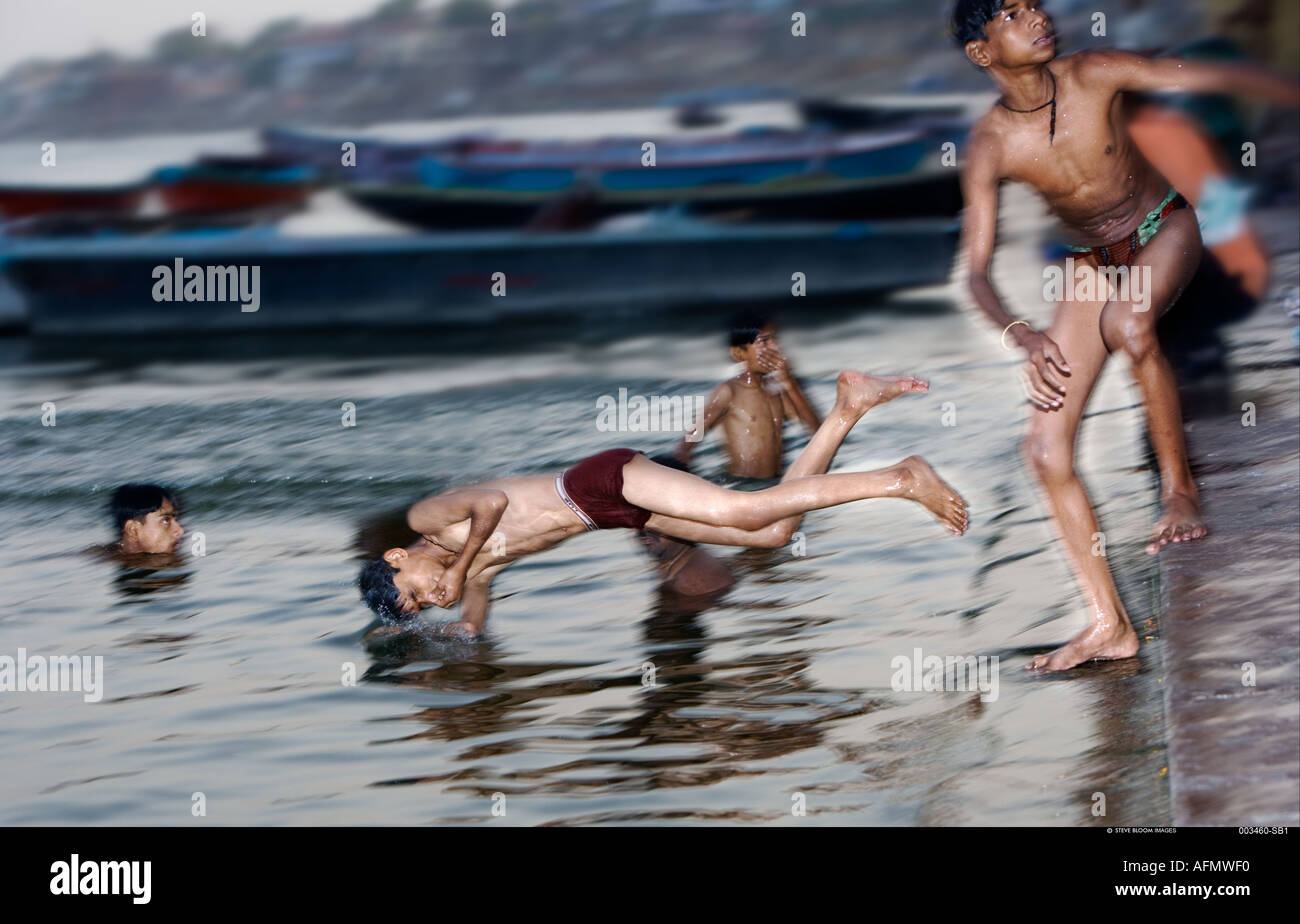 Boys swimming in the Ganges Varanasi India Stock Photo
