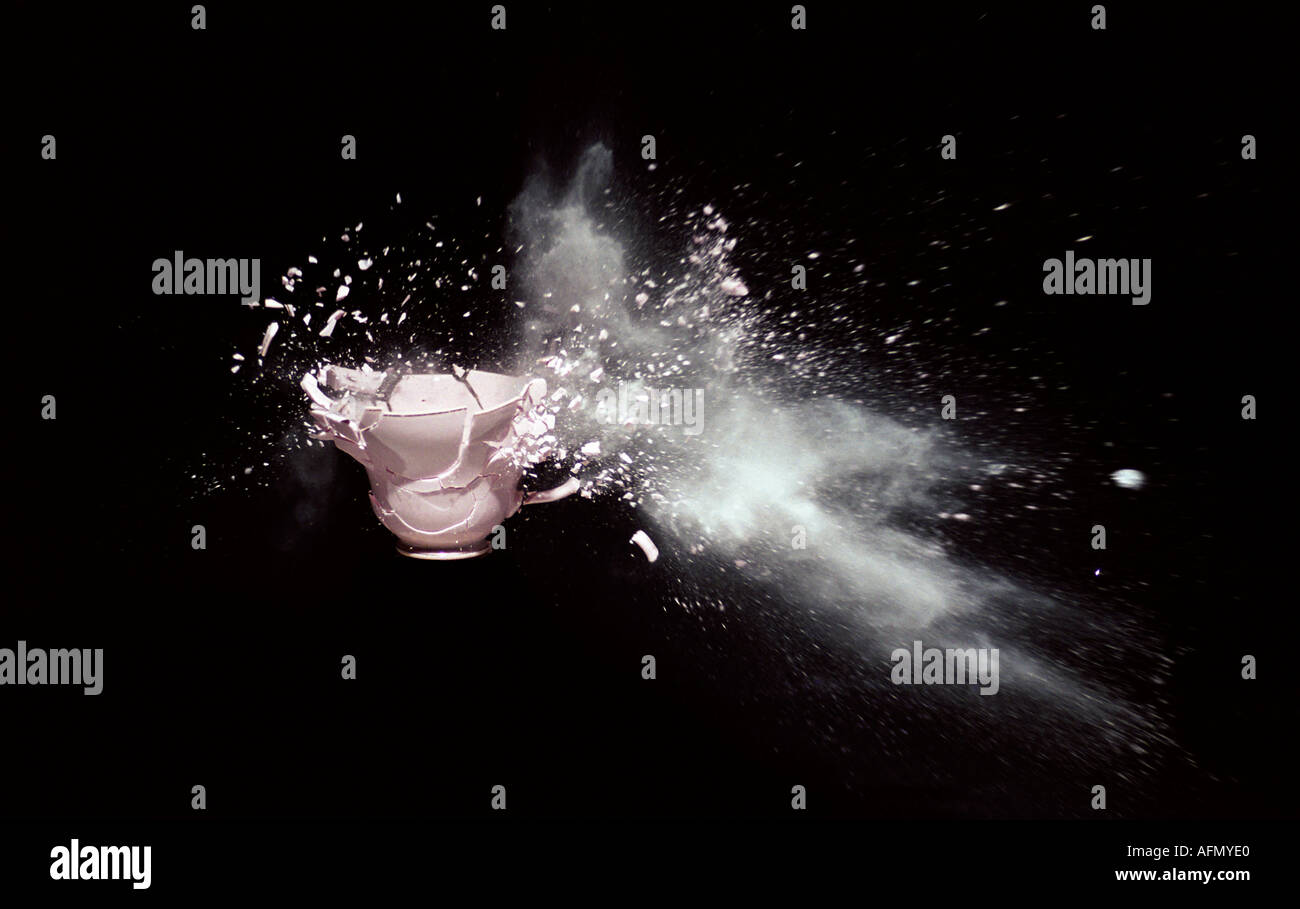 High speed photography showing a teacup exploding on impact from 22 calibre rifle bullet Stock Photo