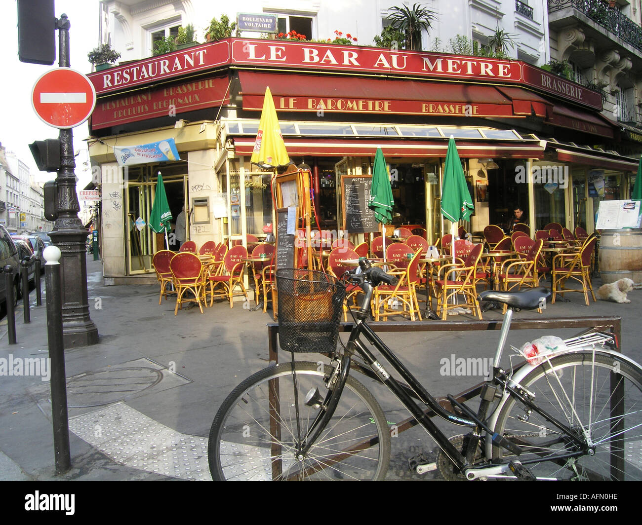 early morning scene at roadside cafe Le Bar au Metre in Boulevard Voltaire Paris France Stock Photo