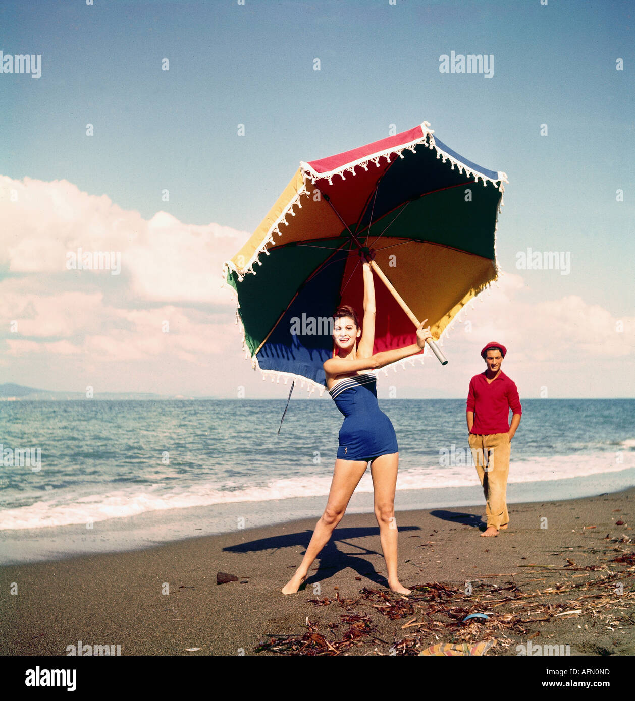 fashion, bathing costume, 1960s, young woman in swimsuit on the beach, 60s, sunshade, , Stock Photo