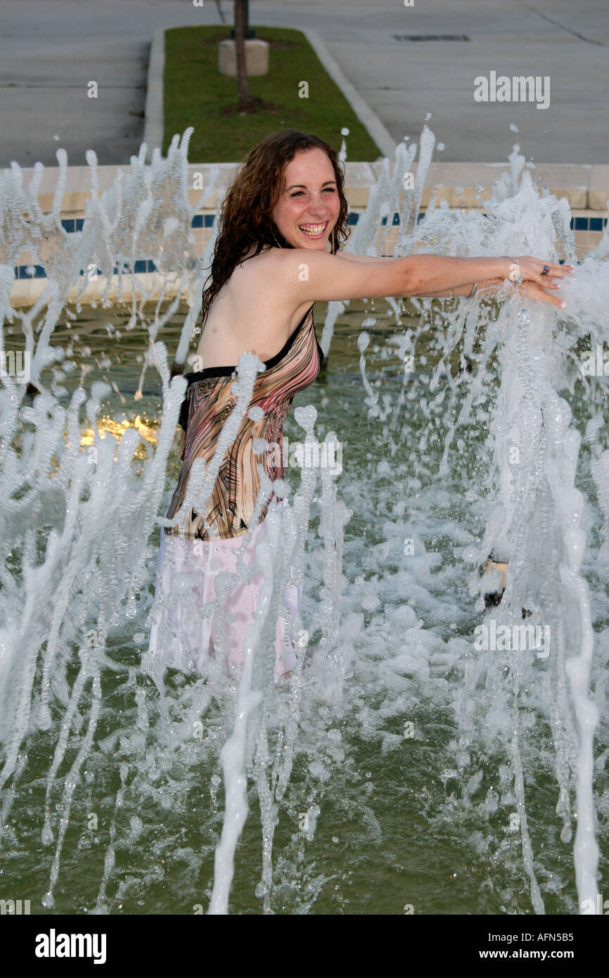 Teenage girl playing in a fountain Stock Photo 2594228 Alamy
