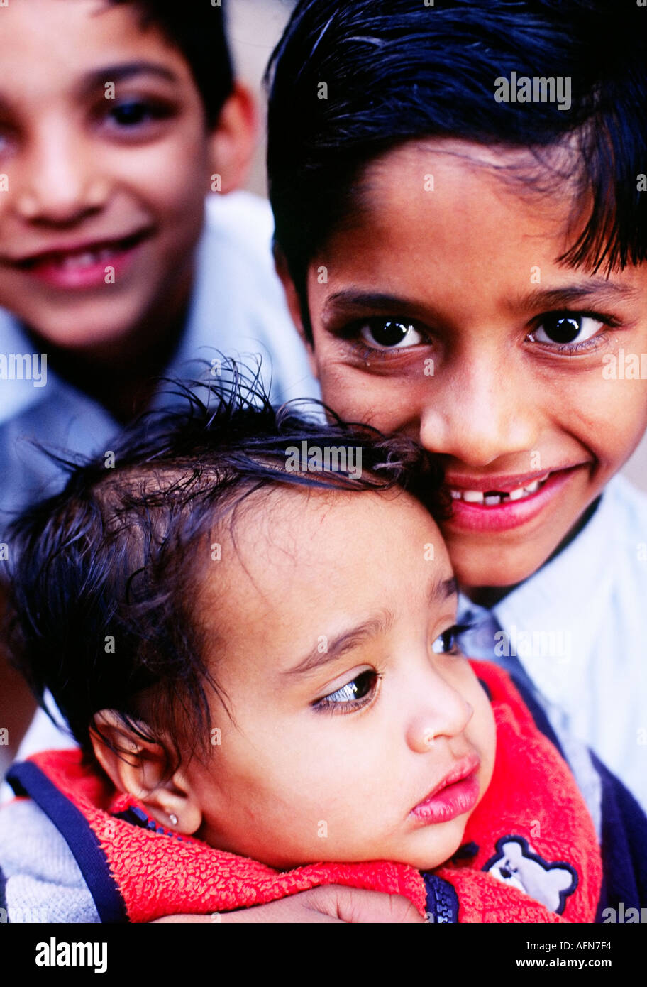 Portrait of young Indian boys smiling posing for the camera India Asia ...