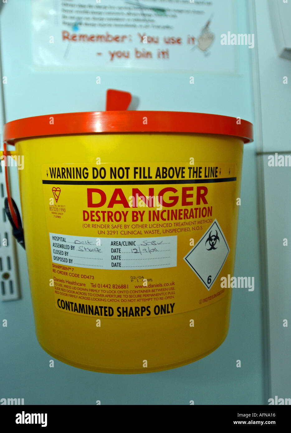 A sharps container in a hospital ward Stock Photo