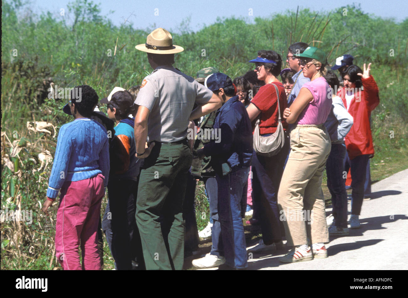 Ranger leads group on exploratory trip on Anhinga trail Everglades National Park Florida Stock Photo