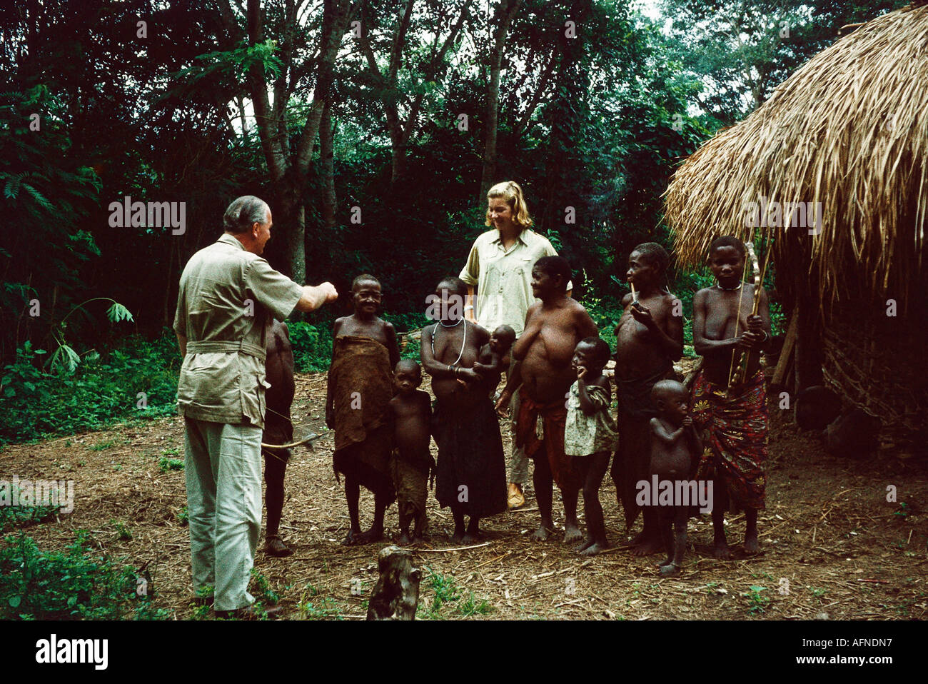 people, ethnology, family, women with children and europeans, Central Africa, pygmies, 1960, Stock Photo